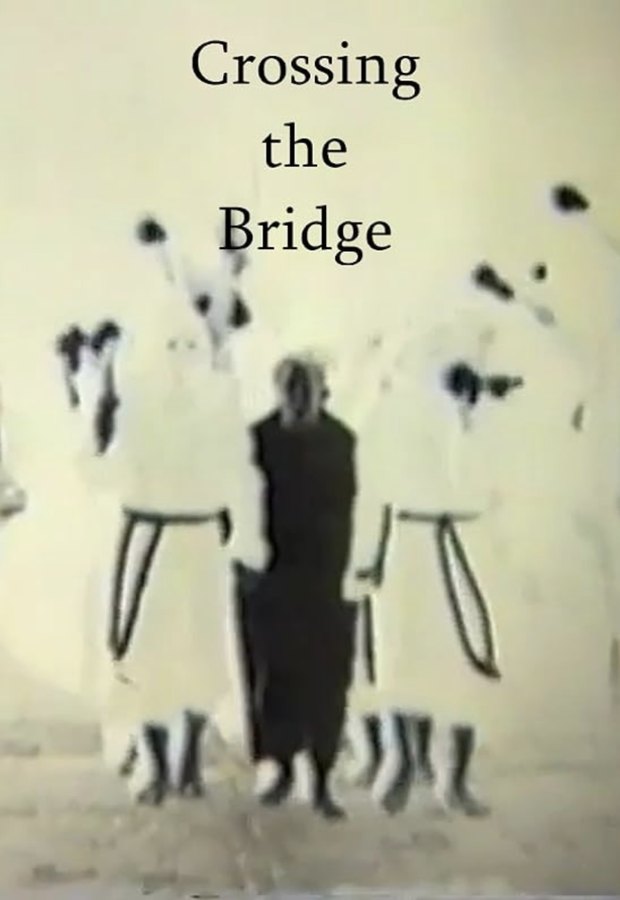 Poster for the documentary short Crossing the Bridge, a painted white wall with dark figures