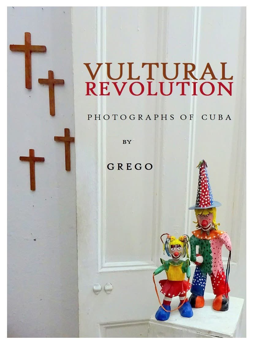 Title card: Vultural Revolution, photographs of Cuba by Grego, with two painted tin clowns beside wooden crosses