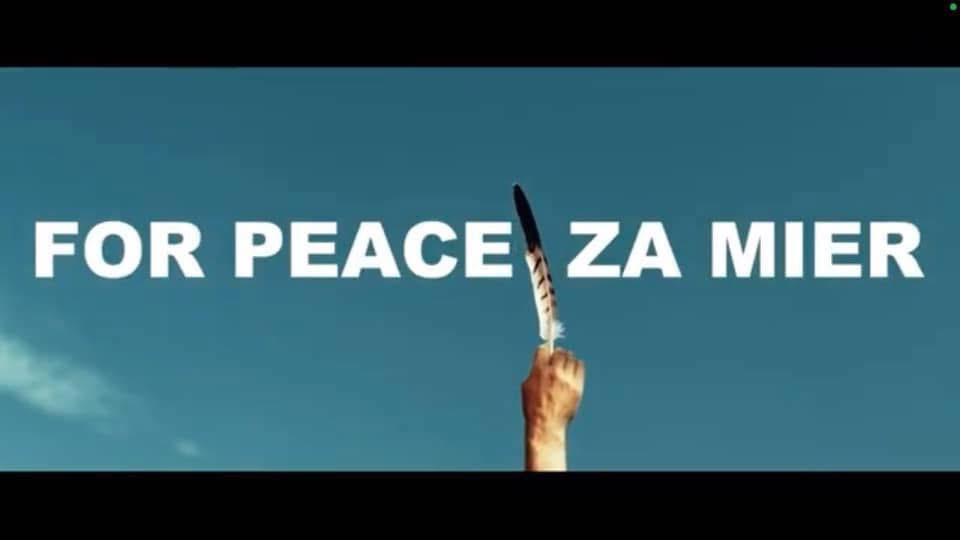 Title card reading For Peace, Za Mier, over a hand holding a feather against the sky