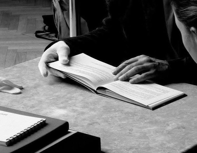 Hands resting on an open book