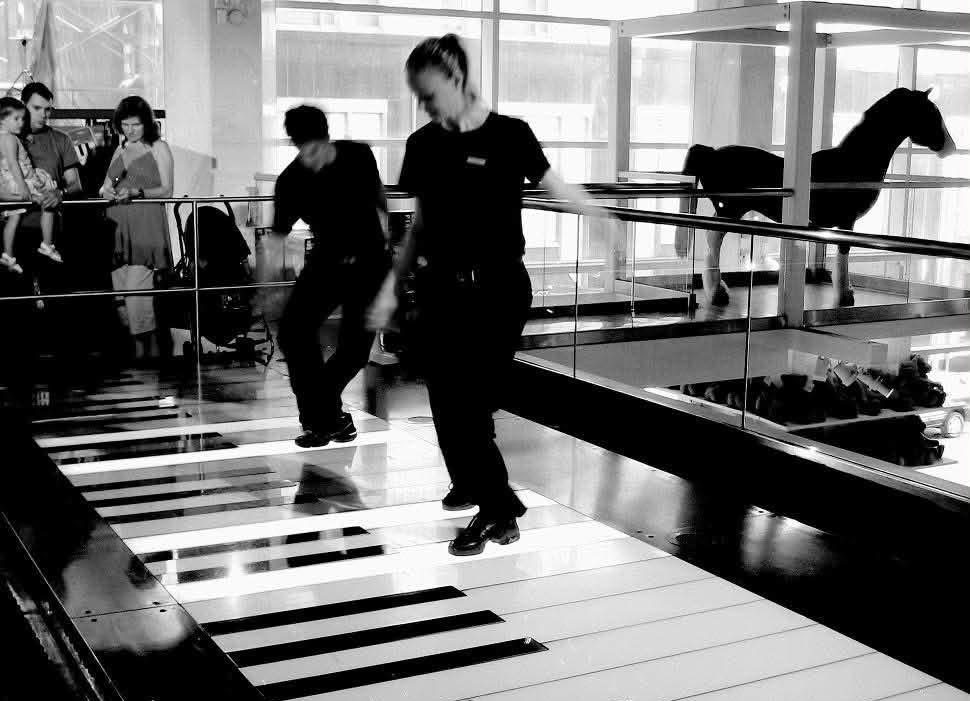 A piano staircase played by two people